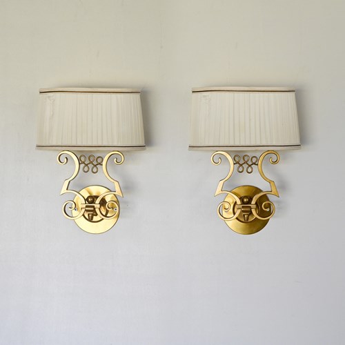 Pair Of Gilt-Bronze Two-Light Wall Sconces — Maison Leleu