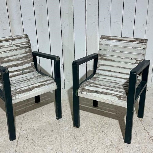 A pair of English Slatted garden chairs circa 1940