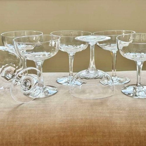7 French hand moulded crystal champagne coupes attributed to Baccarat