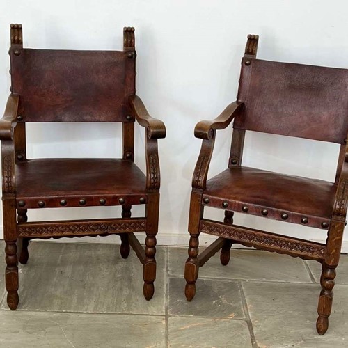 A pair of Spanish oak & Leather armchairs circa 1930