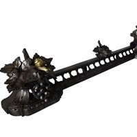 Decorative iron fireplace fender with grapes and s