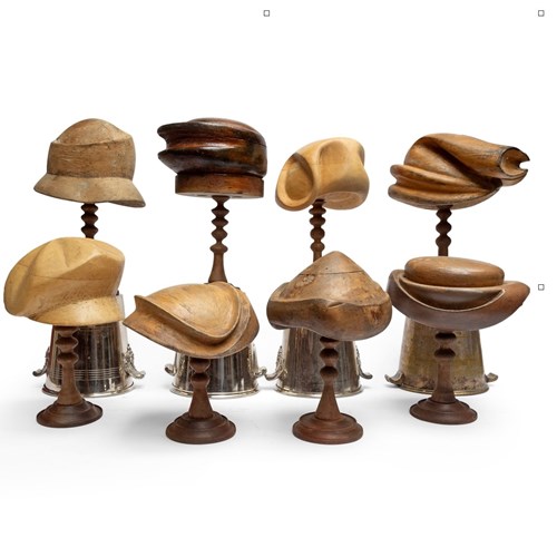 Collection Of 8 Hatmakers' Carved Wooden Blocks On Stands.