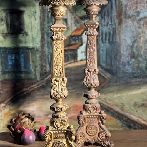 Two Tall Cast Metal Candlesticks