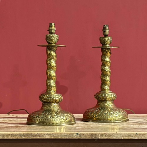 A Pair Of 19Th Century Continental Repoussé Brass Lamps