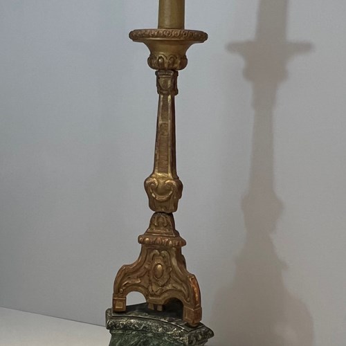 Tall Gilded Carved Wood Candelabra On A Patinated Base.