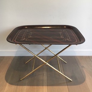 Unusual tray table in brass with a lacquer top