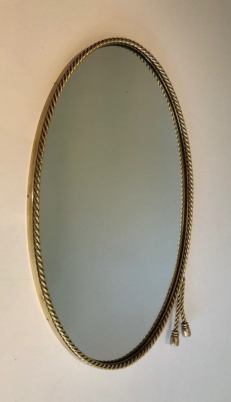  In the style of Maison Bagués. Oval Brass Mirror -barrois-antiques-50s-39850-main-637445040497729959.jpg