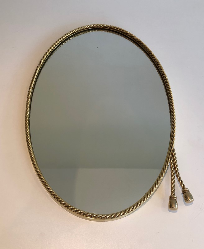  In the style of Maison Bagués. Oval Brass Mirror -barrois-antiques-50s-39851-main-637445040515386615.jpg