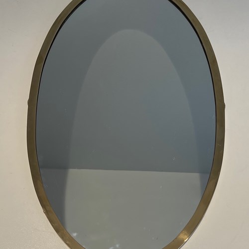 Neoclassical Style Oval Brass Mirror. French Work In The Style Of Maison Jansen.