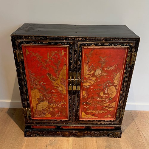 Two Doors Cabinet In Lacquered Wood Presenting Chinese Decorations In Black, Red