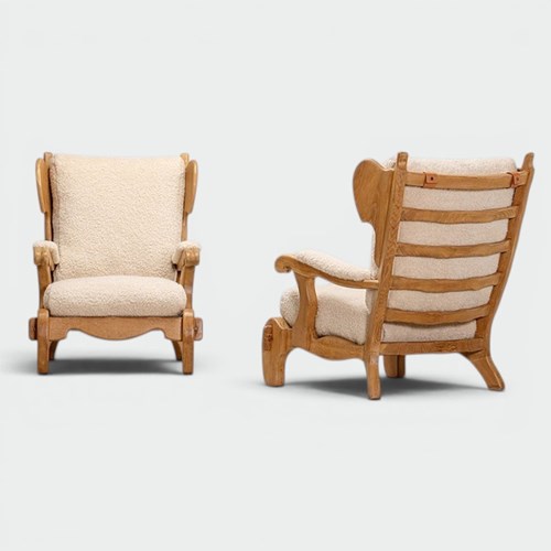 Pair Of Brutalist Sculpted Solid Oak Lounge Chairs With Ivory Bouclé Upholstery.