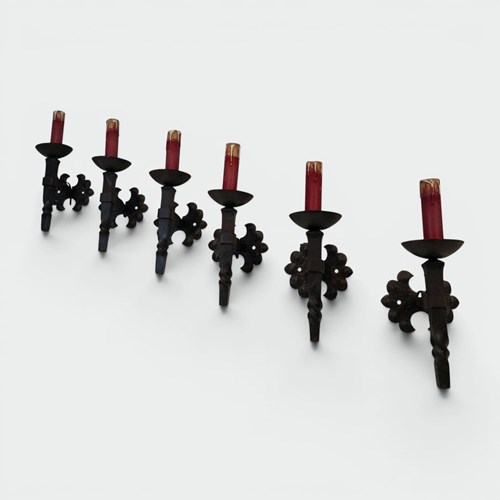 Set Of Six Wrought Iron Torch-Form Sconces With Twisted Stem And Quatrefoil Back