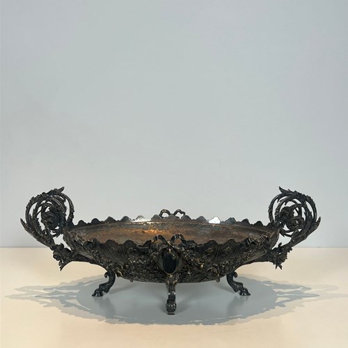 A Silver-Plated, Chased Metal Centerpiece Decorated With Scrolls, Medallions, An