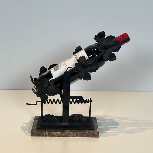 Wrought Iron Decanter Decorated With Vine Leaves On A Marble Base