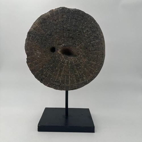 Decorative Element Consisting Of A Millstone On A Steel Base