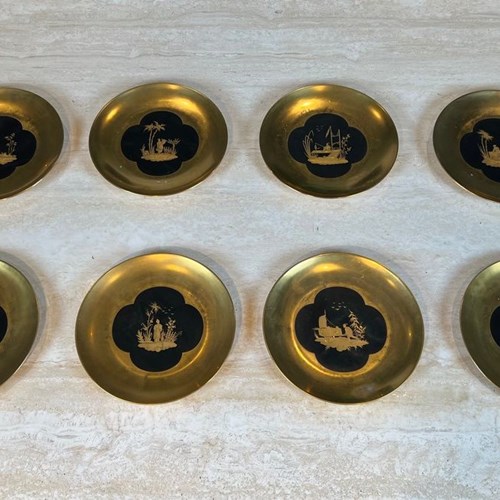 Set Of Eight Gilt Porcelain Plates With Chinoiserie Decoration In Gold On A Blac