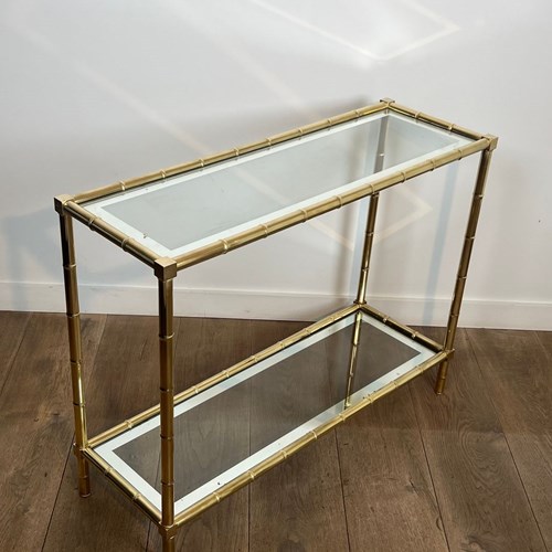 Brass Console Table In Faux-Bamboo Style With Clear Glass Tops Surrounded By A S
