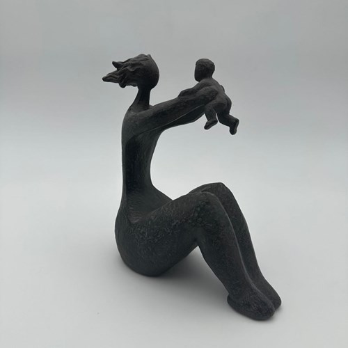Modernist Ceramic Sculpture Depicting A Seated Woman Tenderly Holding A Child In