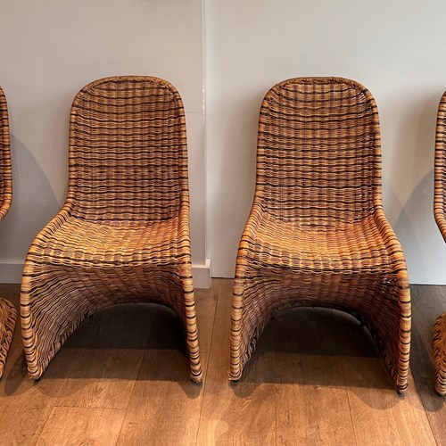 Set Of Four Curved Rattan Chairs. French Work. Circa 1970