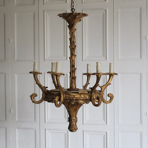 Elegant Mid 20Th Century Carved And Gilded Six Arm Wooden Chandelier