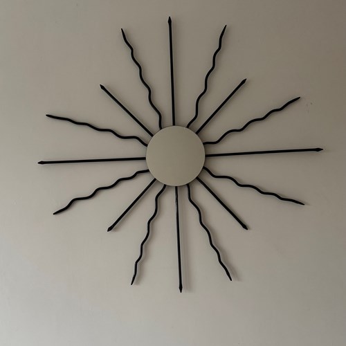 An Black Iron Sunburst Mirror