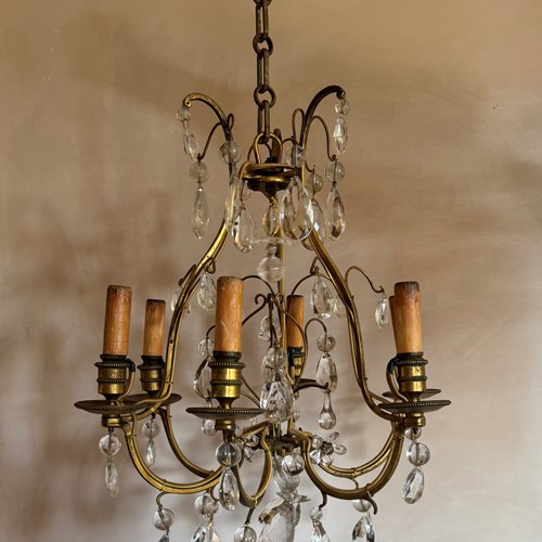 French Gilded Iron And Glass Chandelier Attributed To Bagues