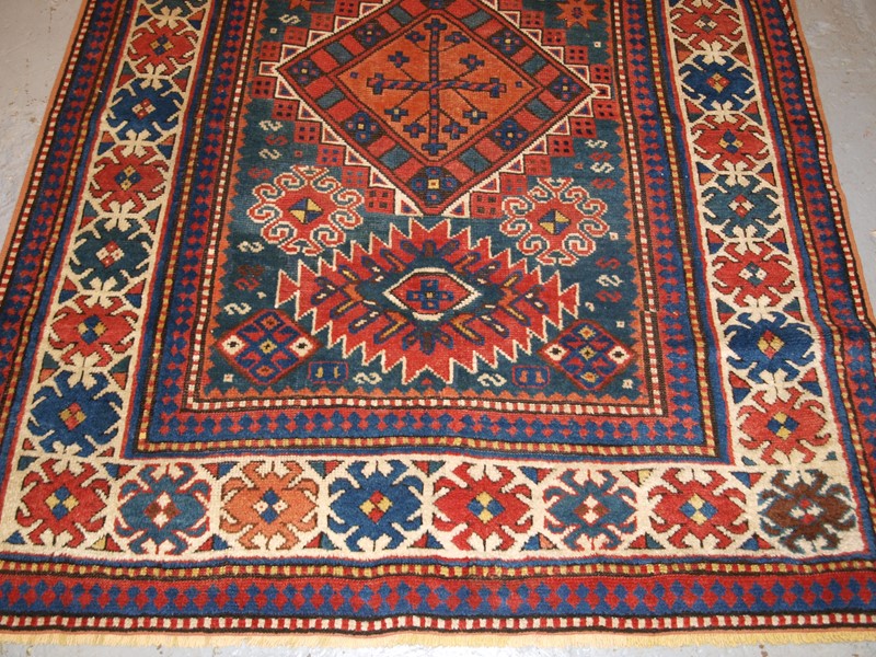 Antique Caucasian Karachov Kazak Rug on Green Grou-cotswold-oriental-rugs-pa077756-main-637788124068551249.JPG