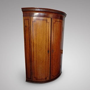 A Country Oak Bowfront Corner Cabinet