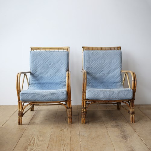 Pair Of Cane Chairs And Matching Footstools