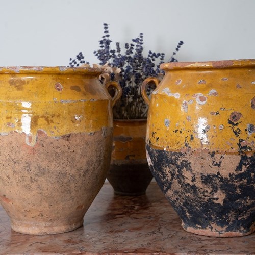 A Pair Of Yellow Glazed Antique Confit Pots