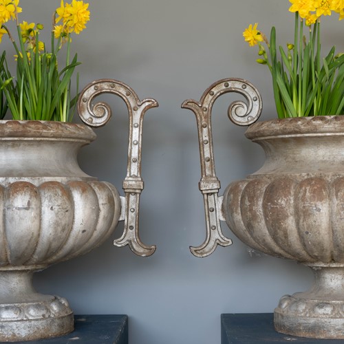 A pair of Alfred Corneau style urns