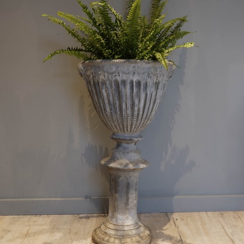 Garden lead urn, on an integral pedestal base