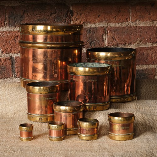 A Rare Set Of 9 Copper And Brass Seer Measures