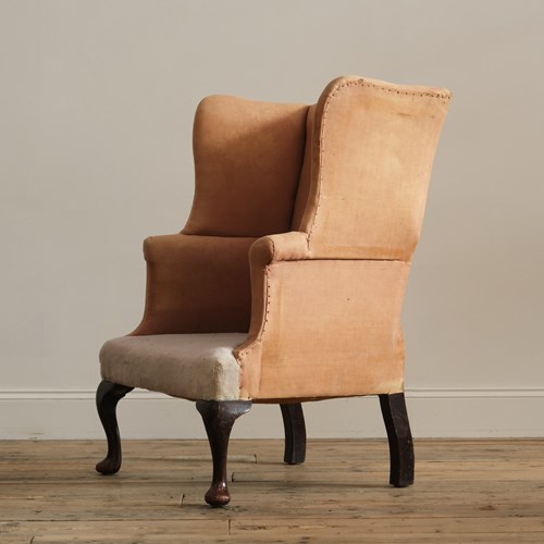 A Good 19Th Century Country House Wingback Armchair. Raised On Tall Cabriolet Fr