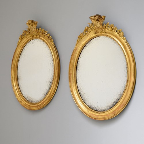 Pair Of Gilded Oval Mirrors