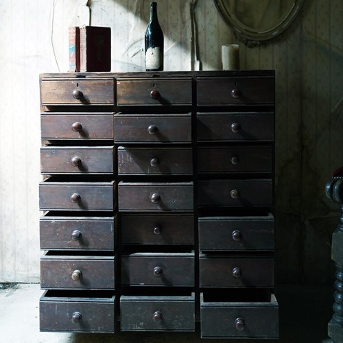 Stained Pine Bank Of Twenty-One Drawers