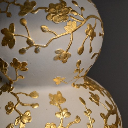 Pair of double gourd bisque and gold leaf lamps