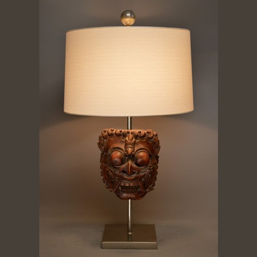 Single antique Polynesian mask mounted as lamp