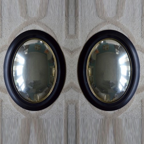 Pair Of Oval Weathered Convex Mirrors