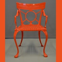 set of four outdoor arm chairs in coral red