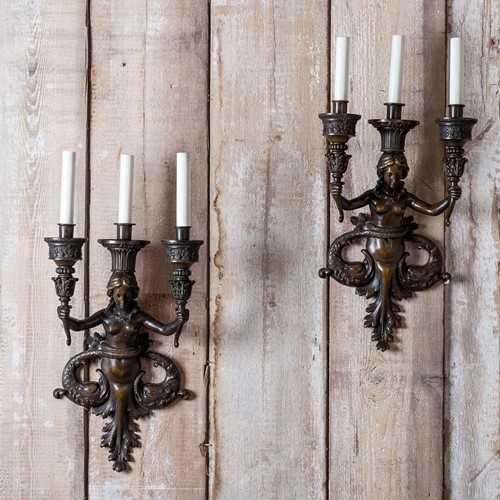 Pair of bronze three light appliques