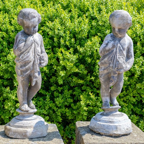 Early C20th lead putti figures