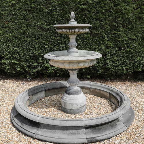 Reclaimed composition stone fountain with surround