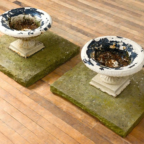 19Th Century Cast Iron Urns On Stone Plinths