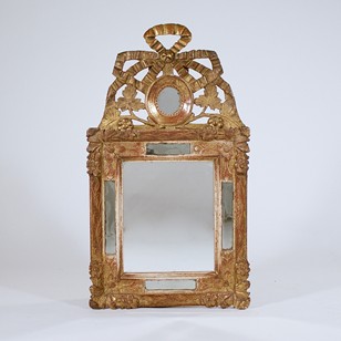 A Louis XVI carved giltwood mirror