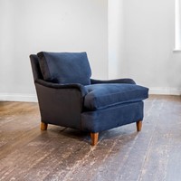 A large and deep upholstered easy chair