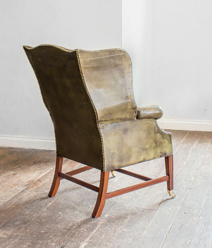 A Mahogany and green leather wing armchair-foster-and-gane-screenshot-2019-03-28-at-143542-main-636893807070641848.png