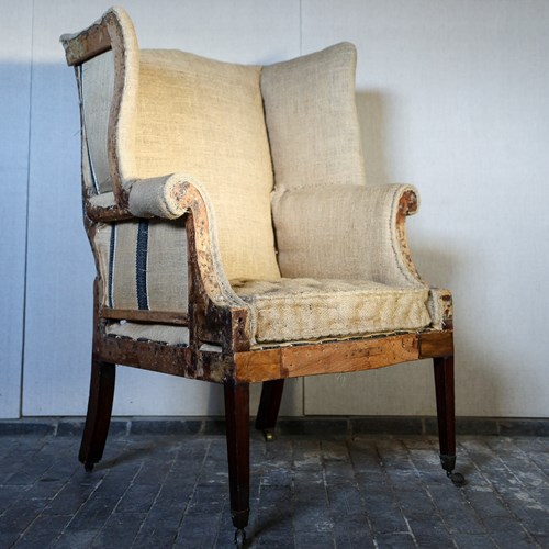 Late 18Th Century Wingback Armchair On Tapering Legs