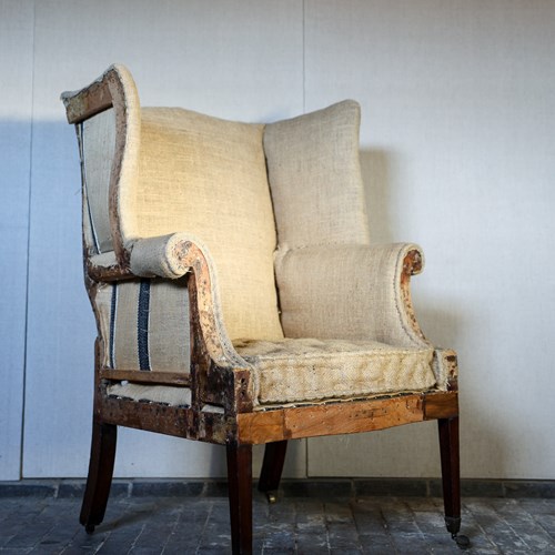 Late 18Th Century Wingback Armchair On Tapering Legs