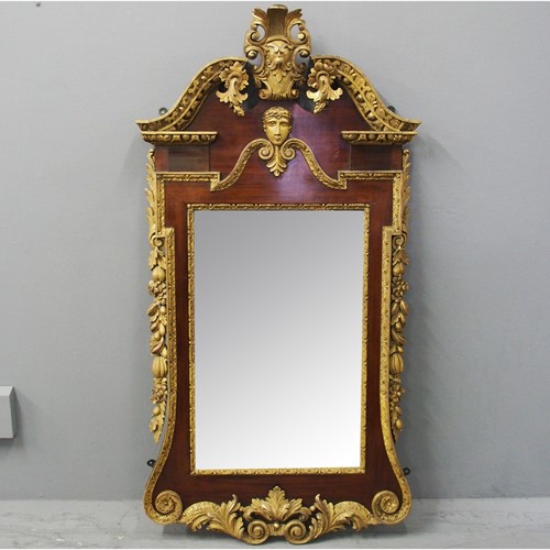 George II Style Carved Walnut and Gilded Mirror